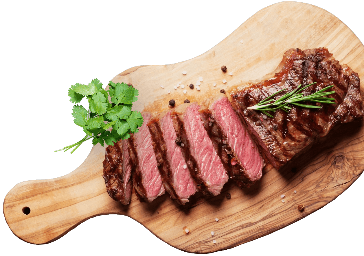 Grilled sliced beef steak on cutting board
